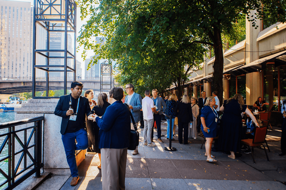 People mingle outdoors in chicago along the riverwalk