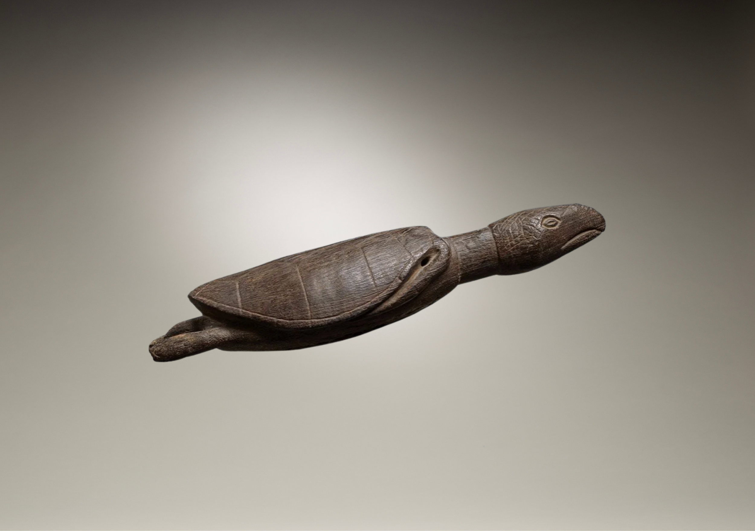 Torres Strait hardwood turtle hunting charm, early 19th century, length 13.75 inches, Australia