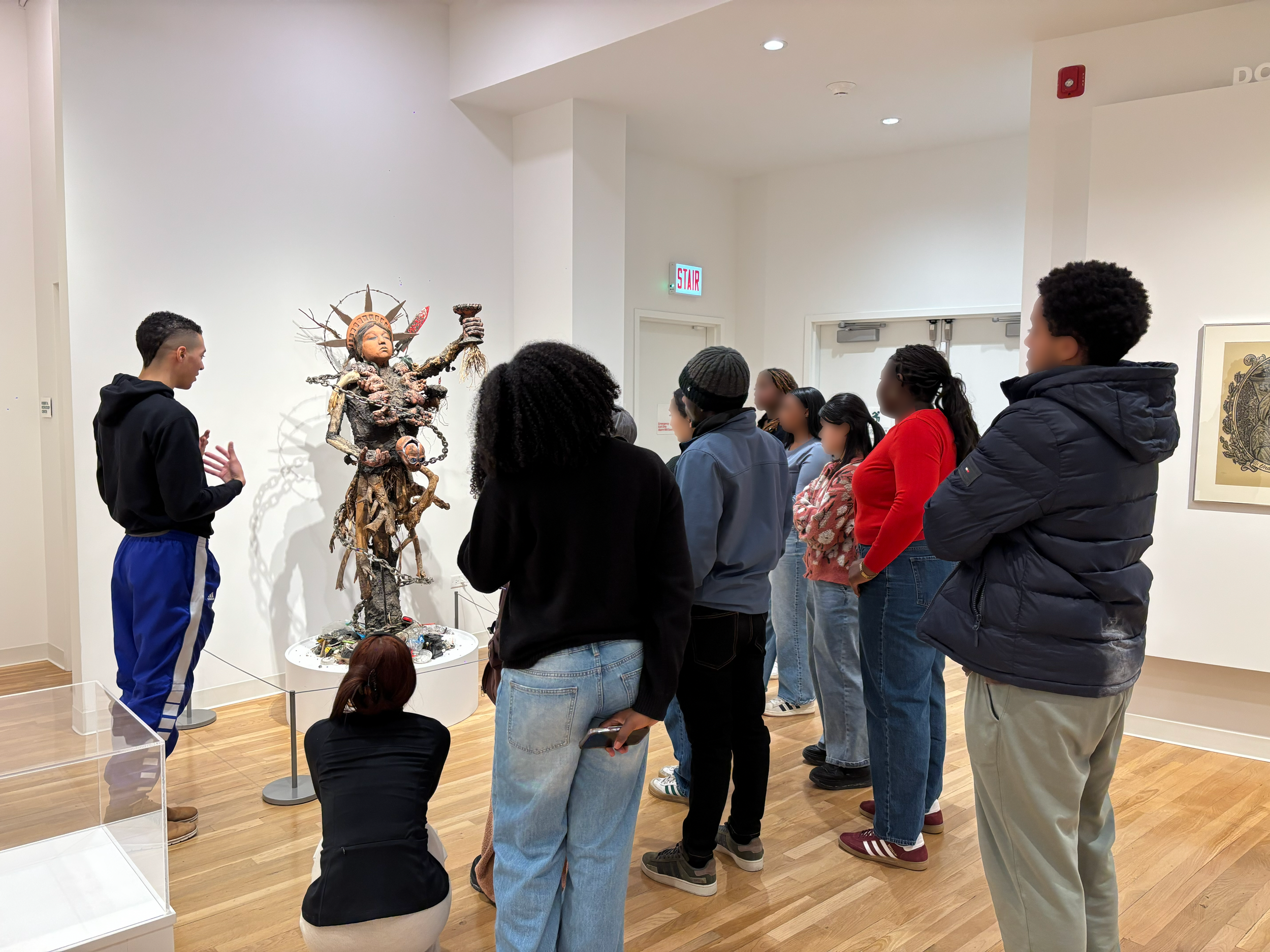 Field Trip to the Intuit Art Museum in February 2026, I'm guiding my students in analyzing a sculpture by Chicago and Evanston artist Piloto.