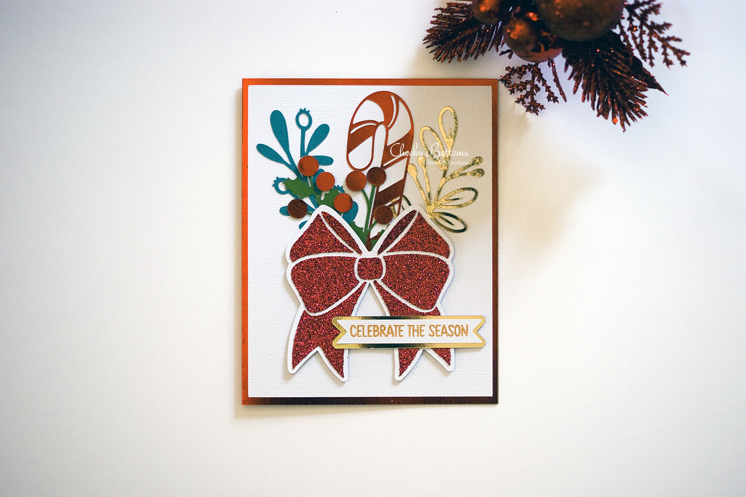 Celebrate the Season greeting card made with a combination of foil and glitter cardstock. 