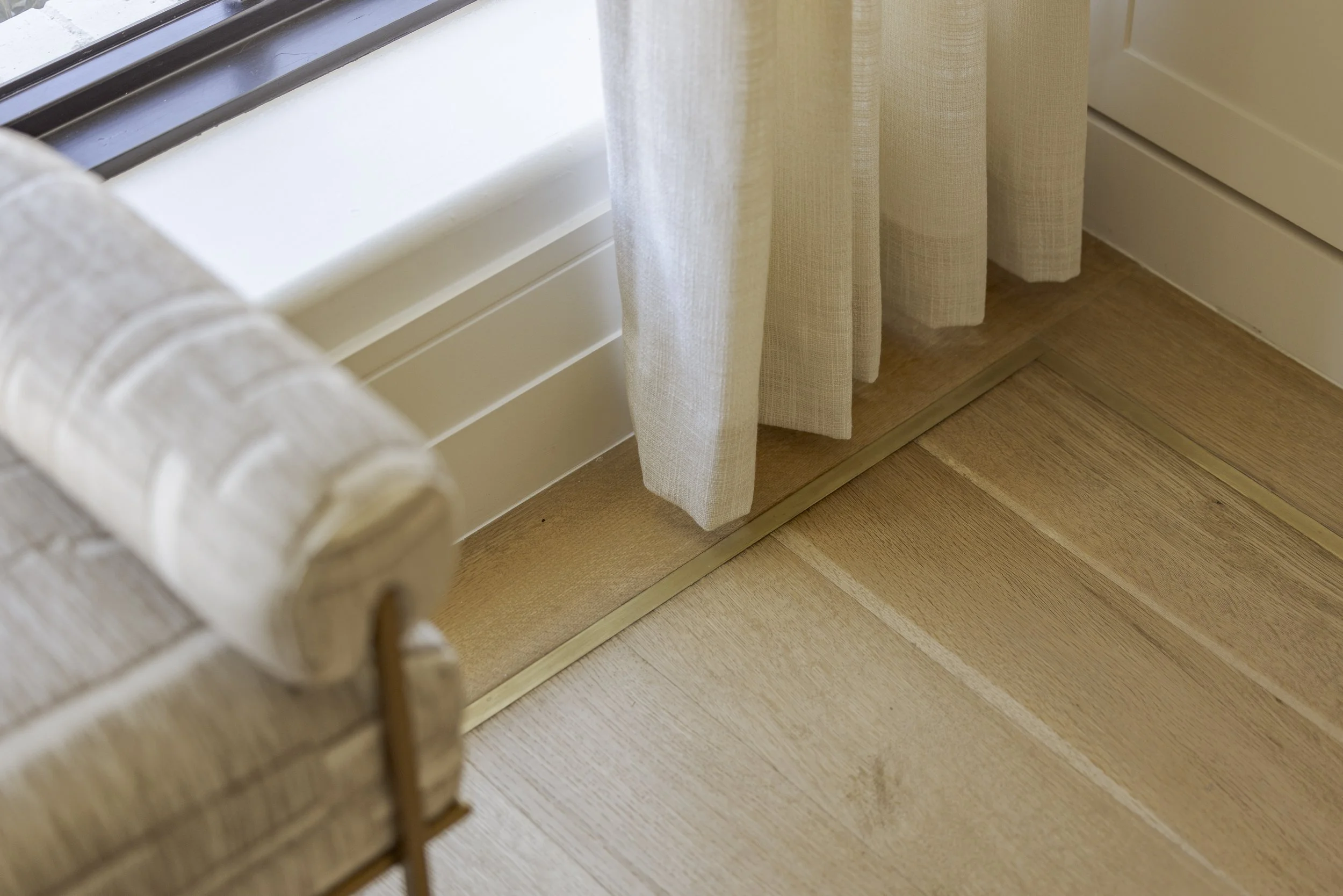 Inlayed gold floor trim
