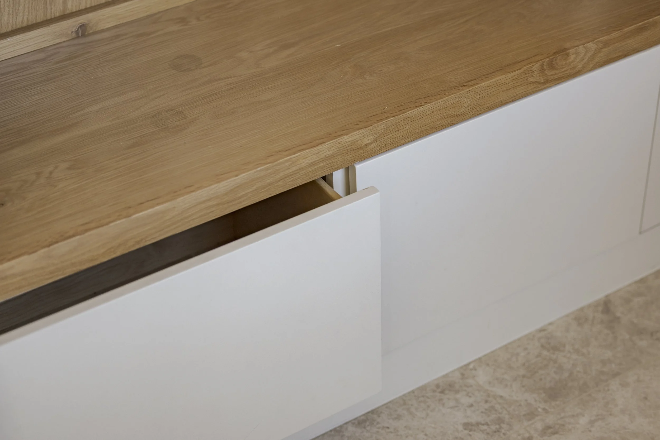 Built in storage drawers at back drop zone