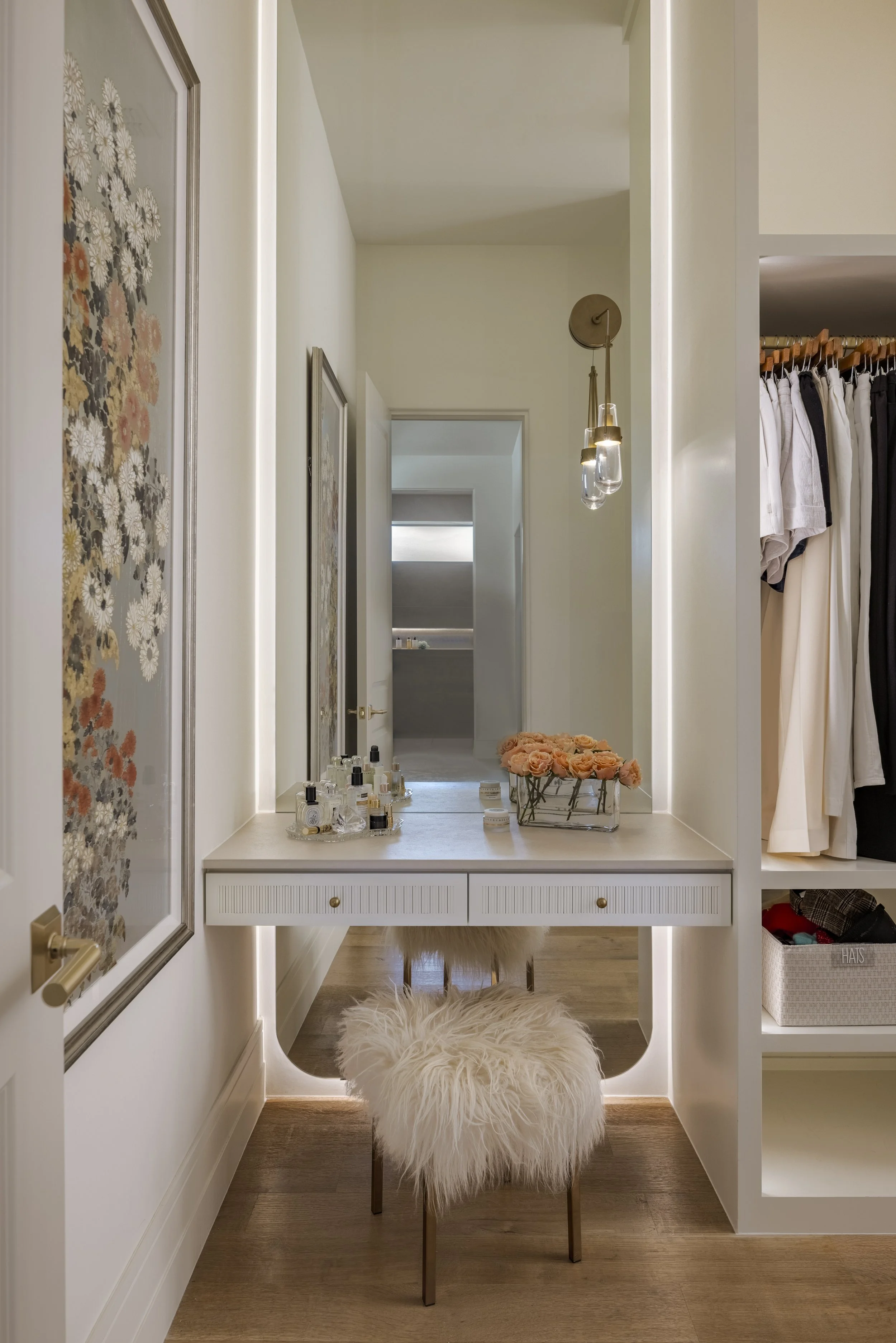 Her closet with makeup vanity