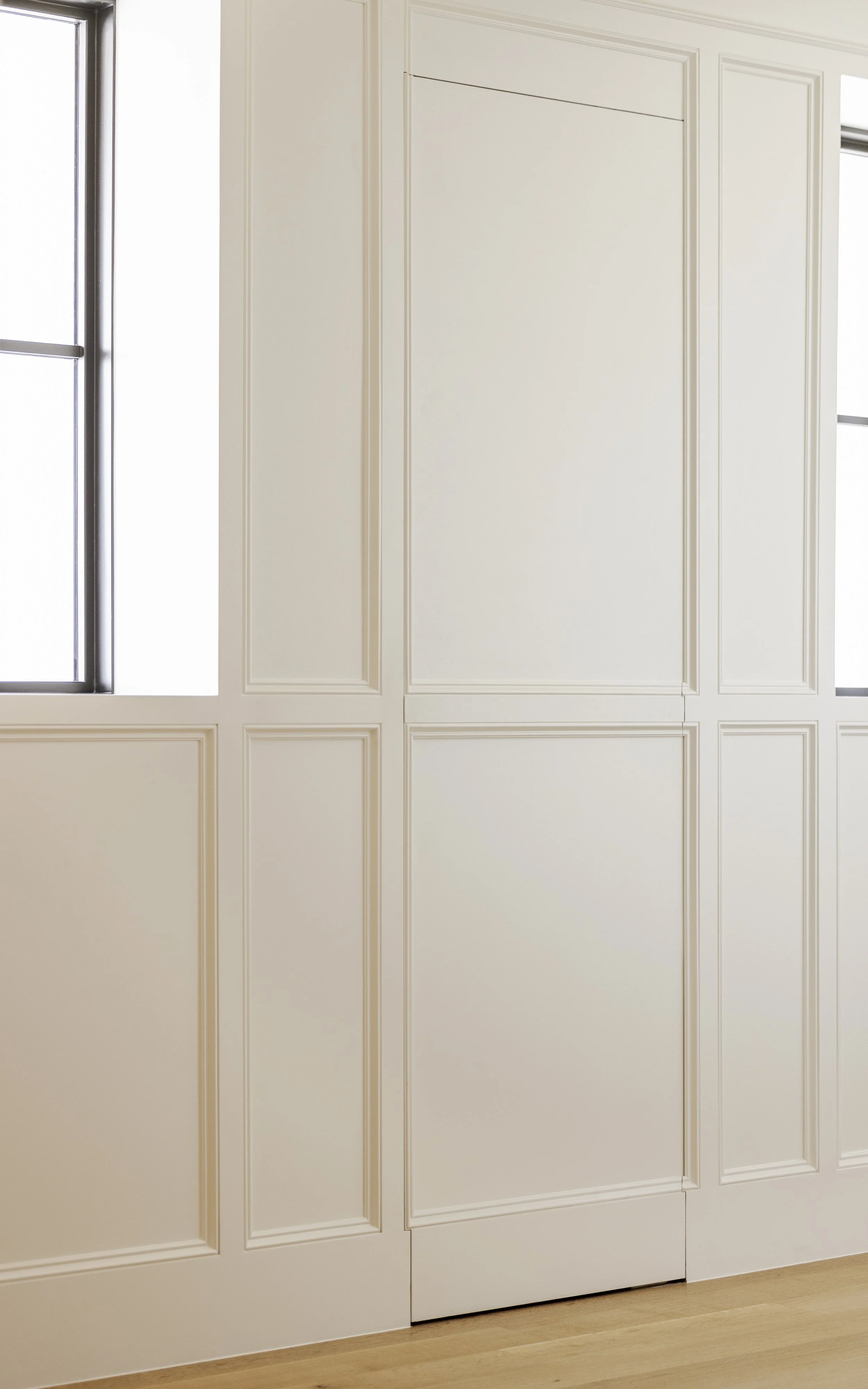 Hallway wall paneling with hidden storage