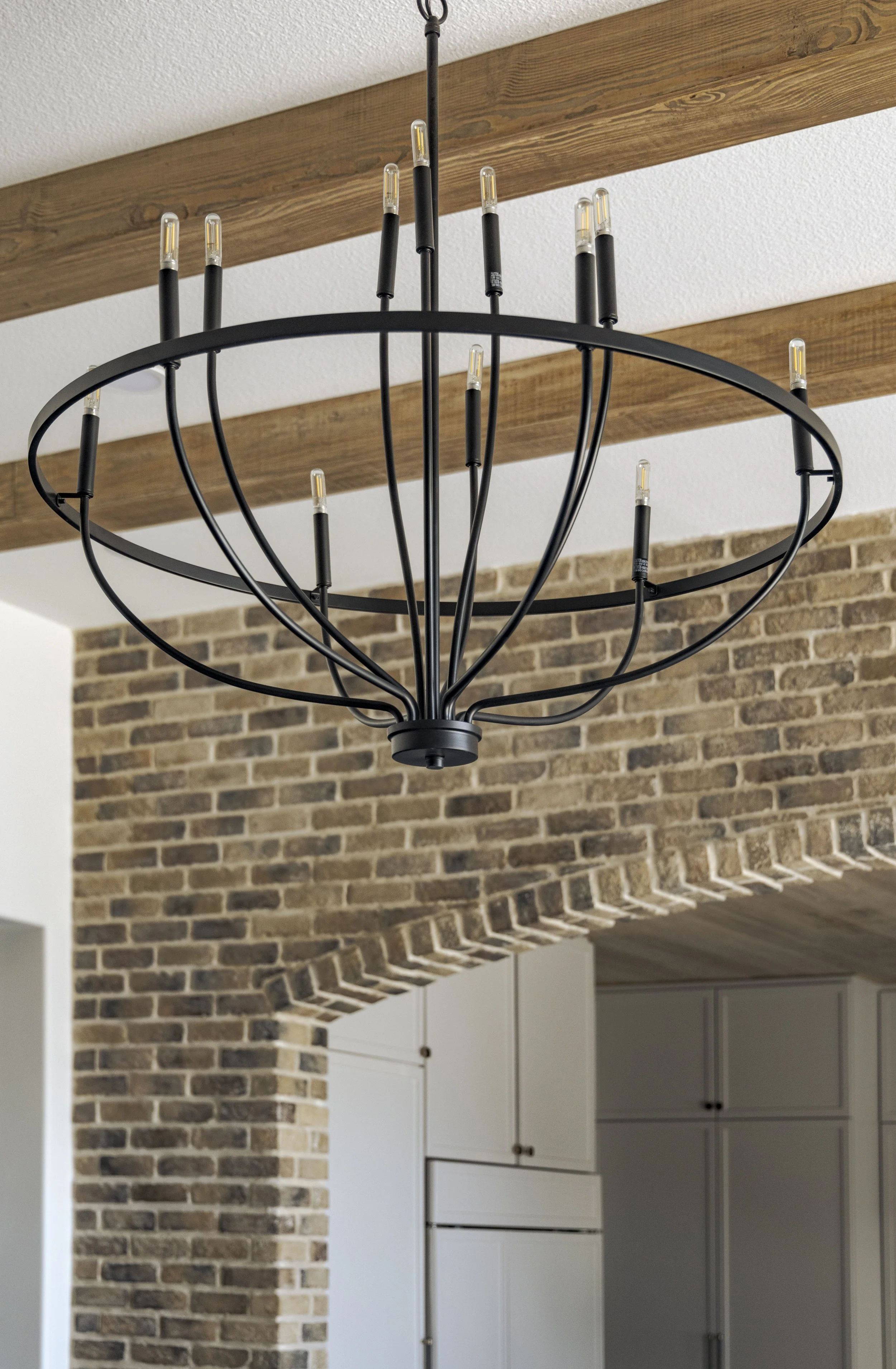 Fmly Room Light Fixture Wood Ceiling Beams & Brick.jpg