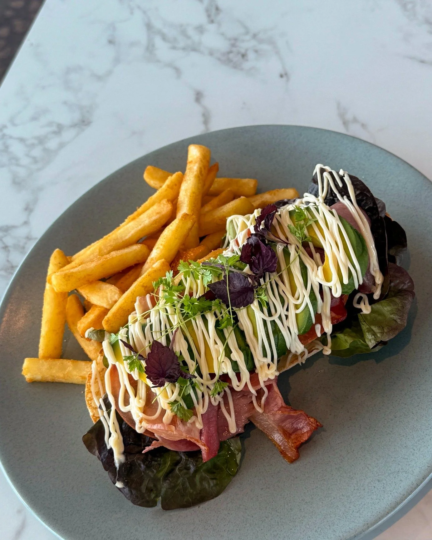 Satisfy your hunger without breaking the bank with this Open B.L.A.T from the Bistro's new Weekday $21* Lunch Specials menu! 🥓 🥬 🥑 🍅 With toasted Turkish bread topped with grilled bacon, red oak lettuce, fresh avocado, tomato &amp; kewpie mayo, i