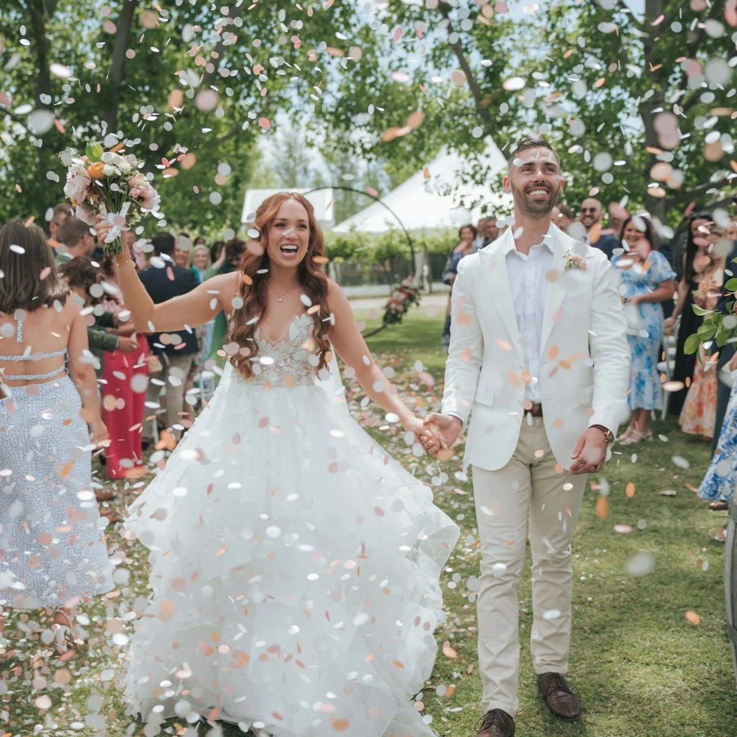 BOOM! It's confetti time. If you're wondering what confetti to get these biodegradable pastel coloured circles are PERFECT for photos. They also dissolve in the rain.