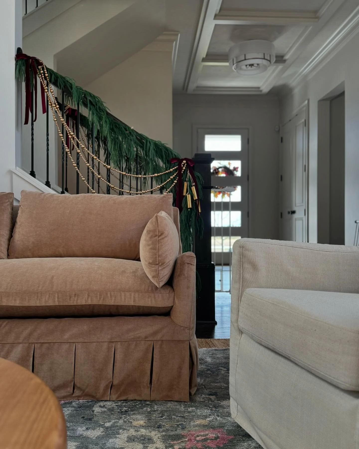 was too busy being blinded by the sheer beauty of these sofas + @indianapolisneat holiday magic to notice that gate before capturing this scene. inching closer to the finish line on this warm hug of a home 🫶✨