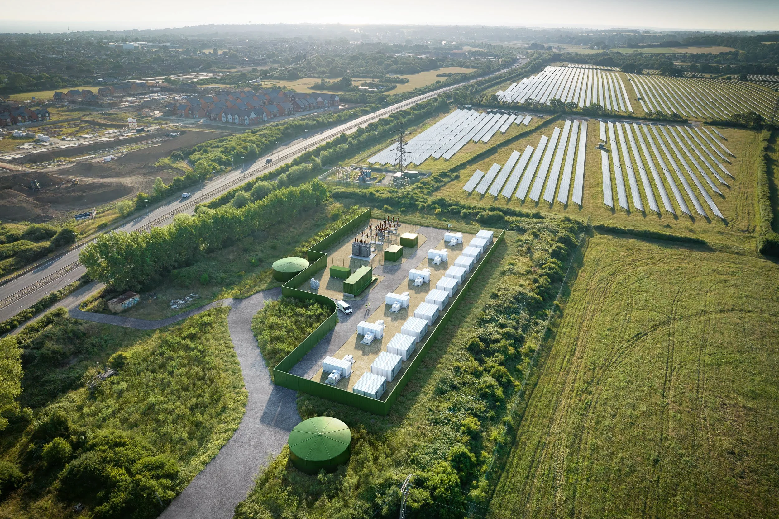 Photorealistic drone photomontage of BESS battery storage facility with solar farm context and landscaping mitigation — planning visual, Preconstruct