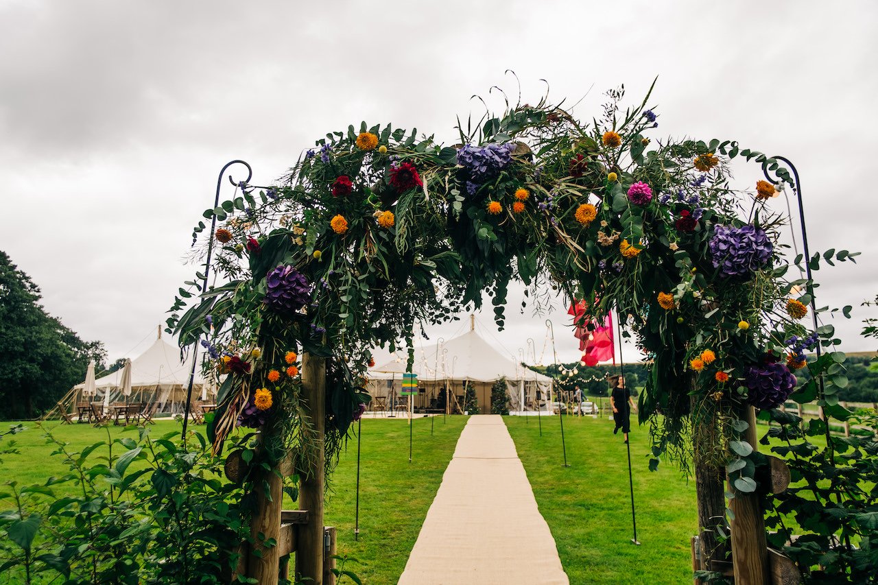 campbells-flowers-summer-outdoor-marquee-wedding-arch.jpg