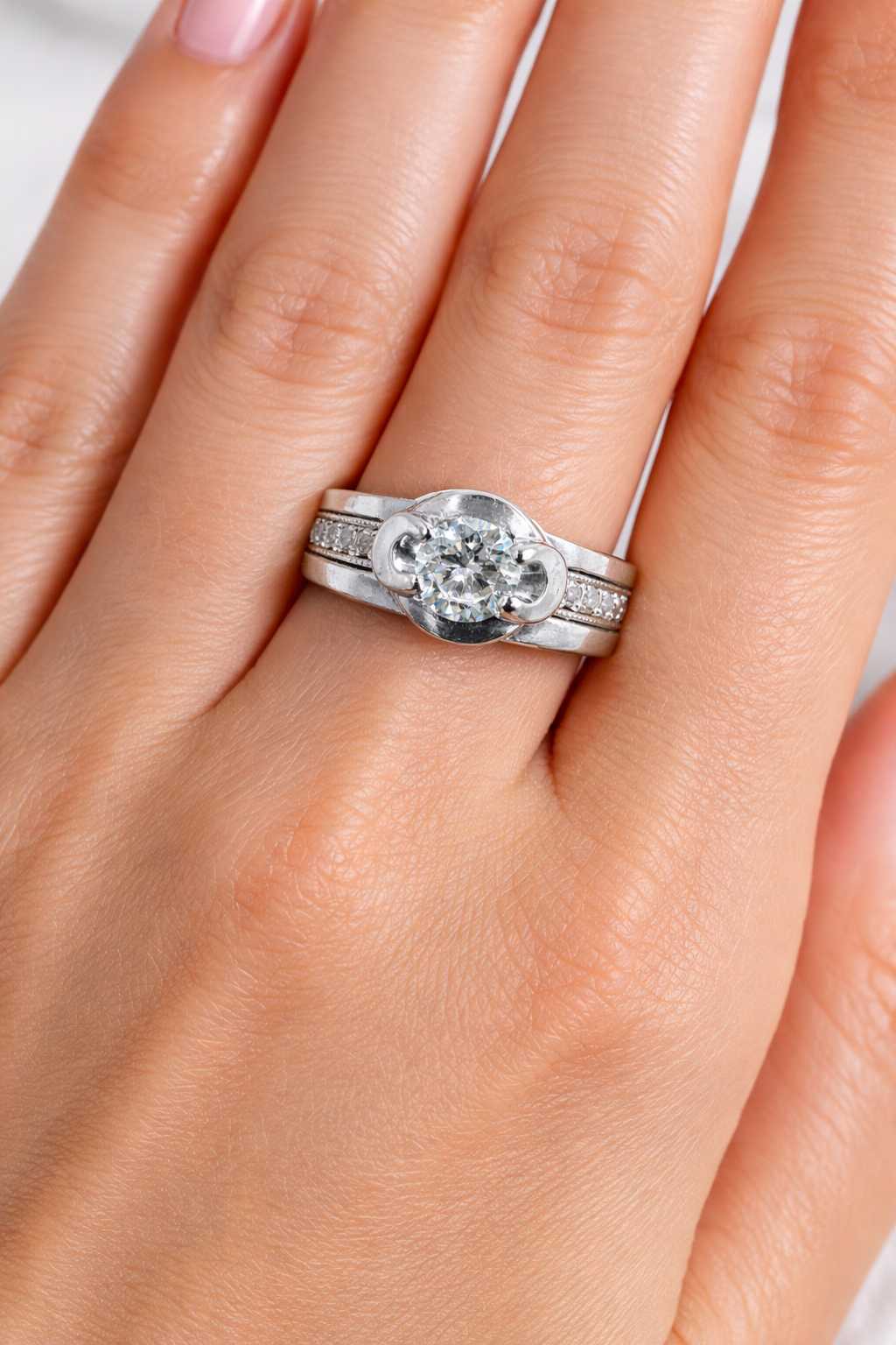 Elegant white gold engagement ring details.png