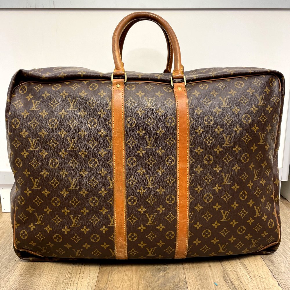 Sold at Auction: Louis Vuitton Monogram Sirius Suitcase 65