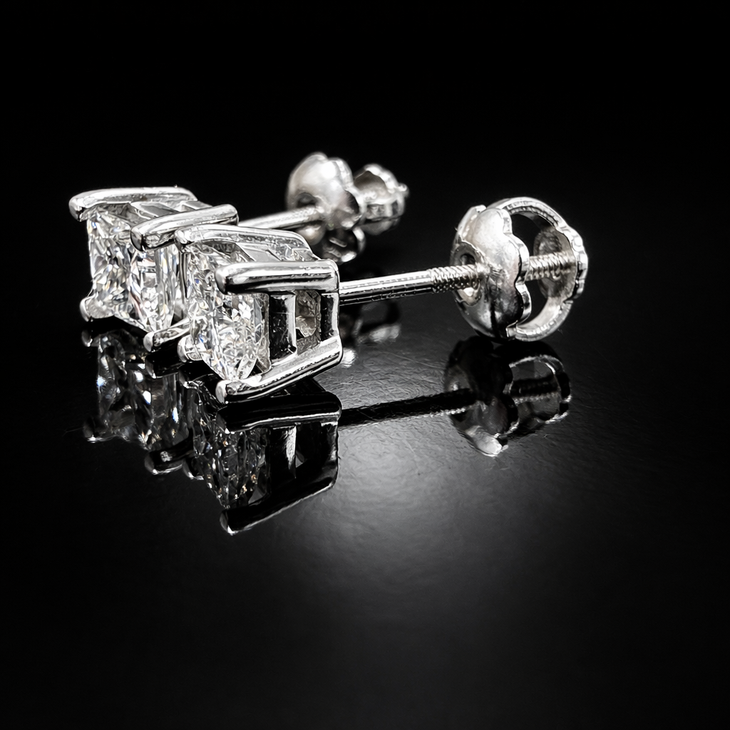 Sparkling diamond stud earrings on black.png