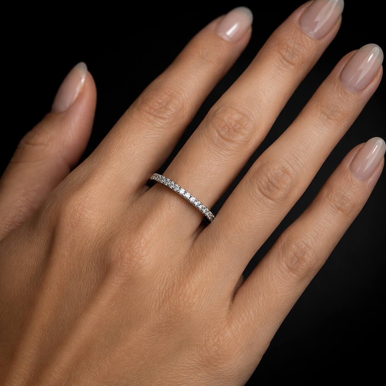 Elegant hand with diamond ring.png