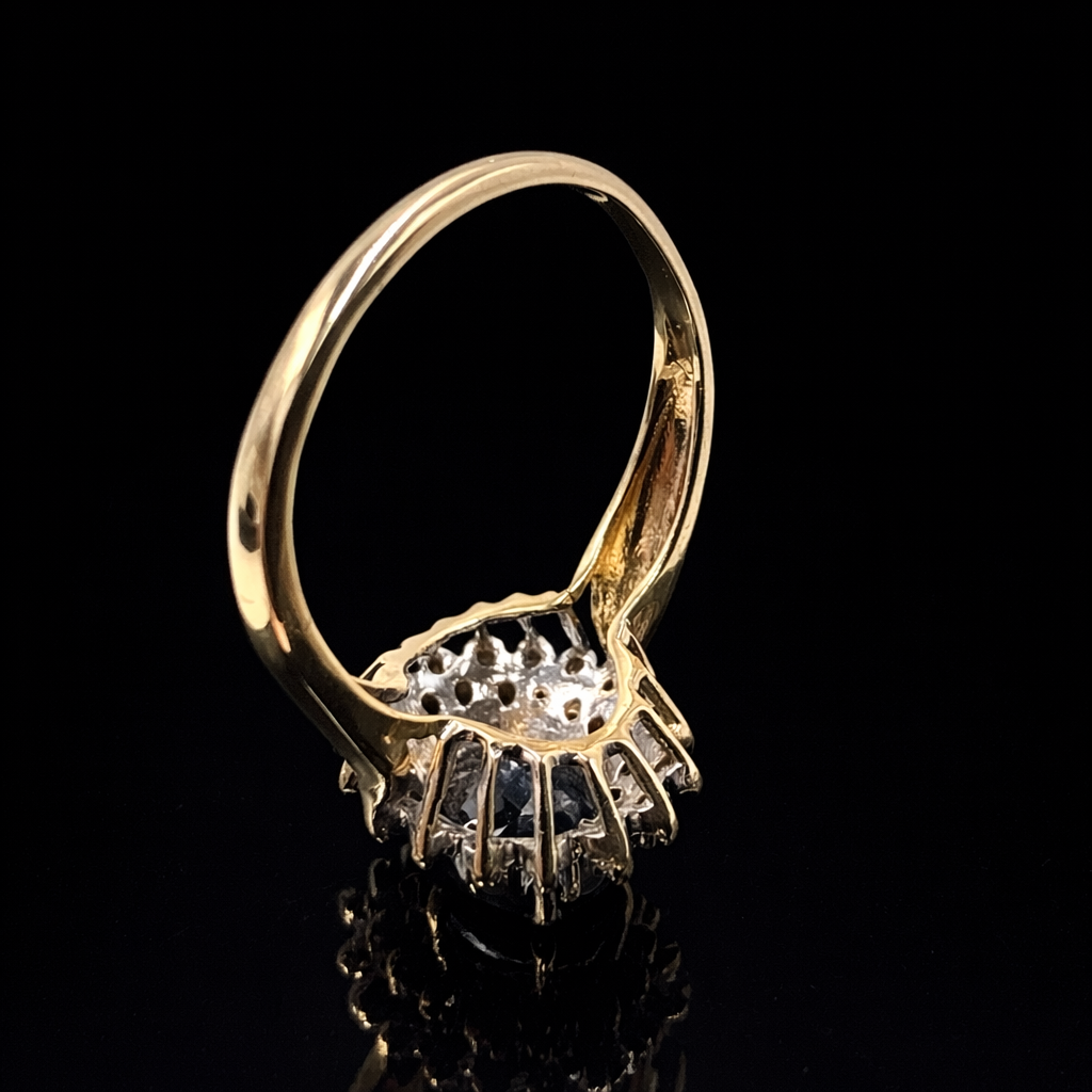 Elegant gold ring on black backdrop.png