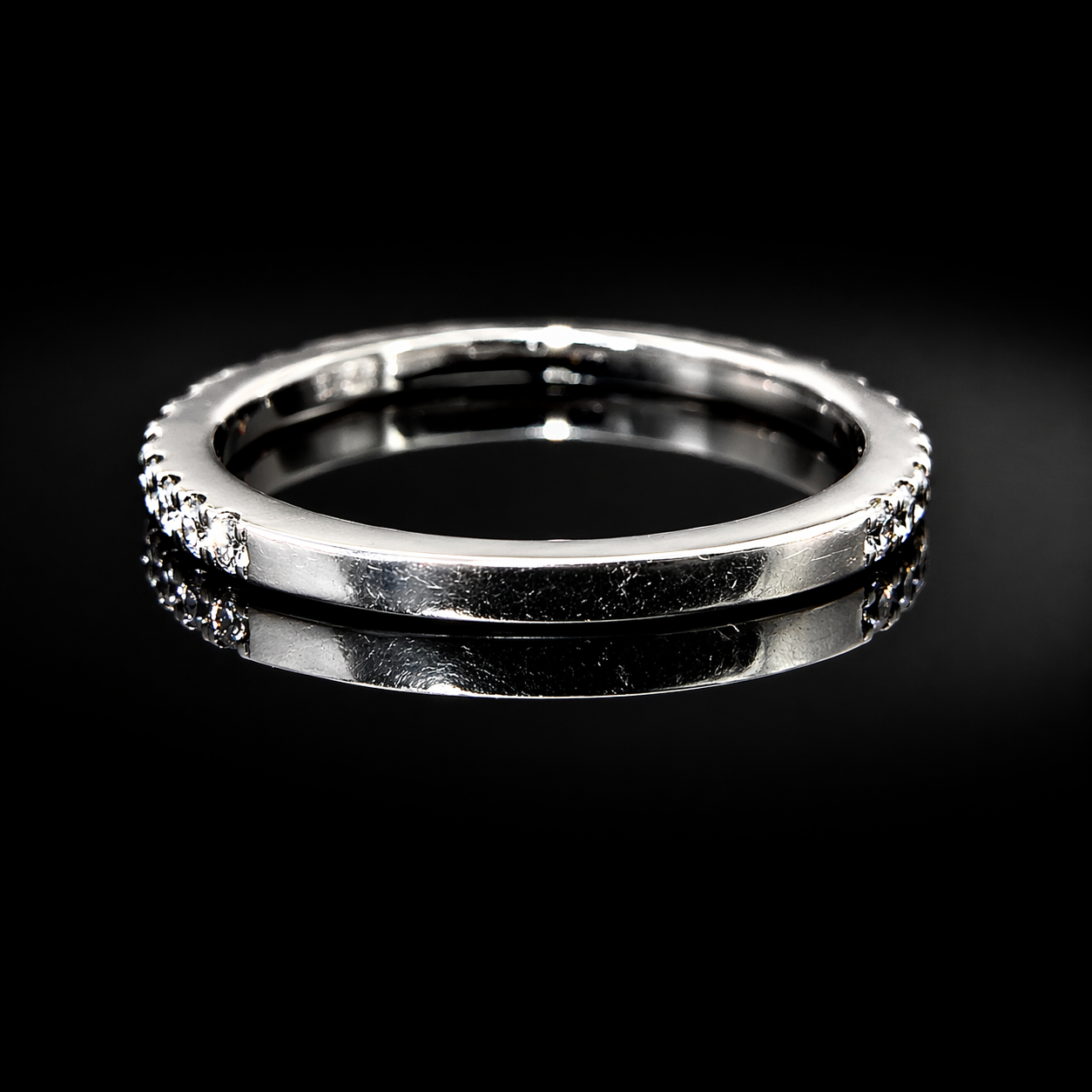 Elegant silver ring with sparkling diamonds.png
