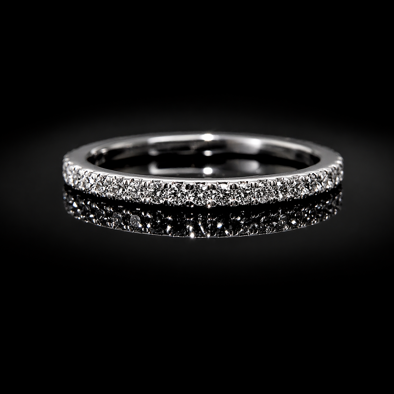 Gleaming diamond ring on black velvet.png