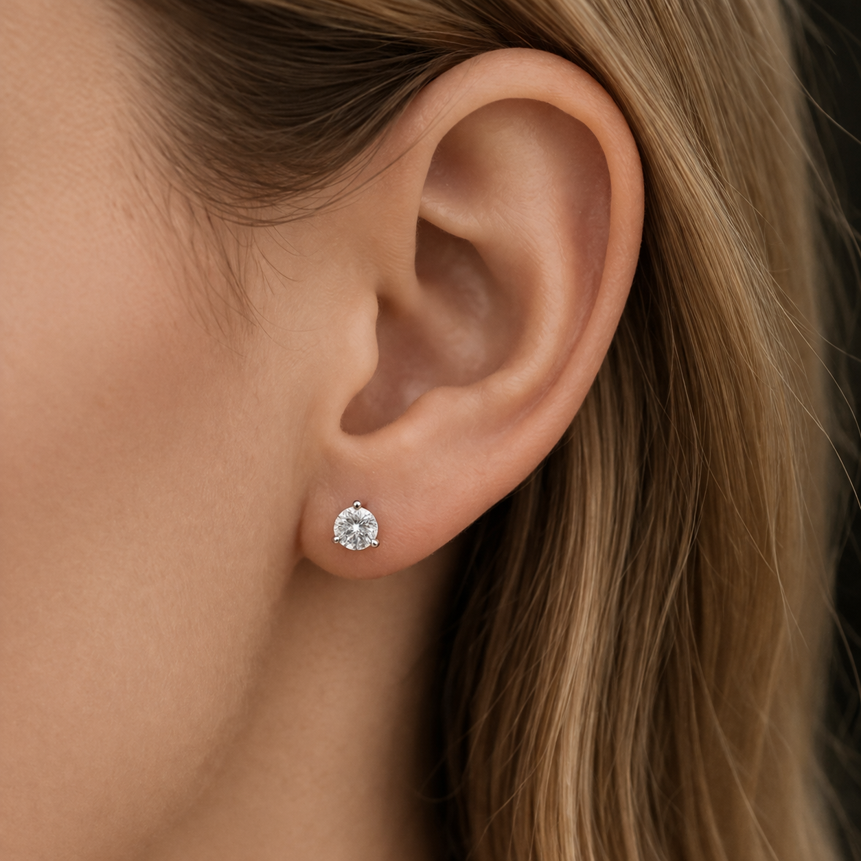 Delicate ear and sparkling stud earring.png