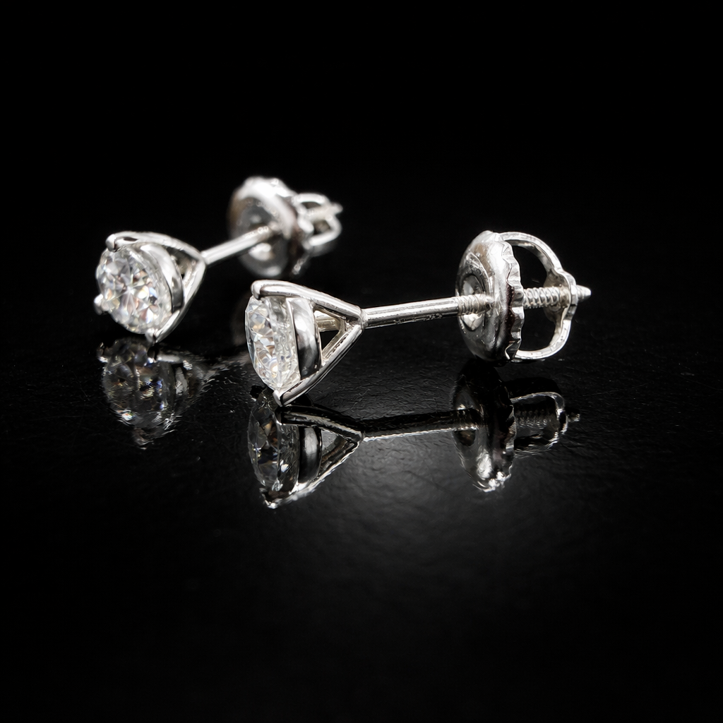 Sparkling diamond studs on black surface.png