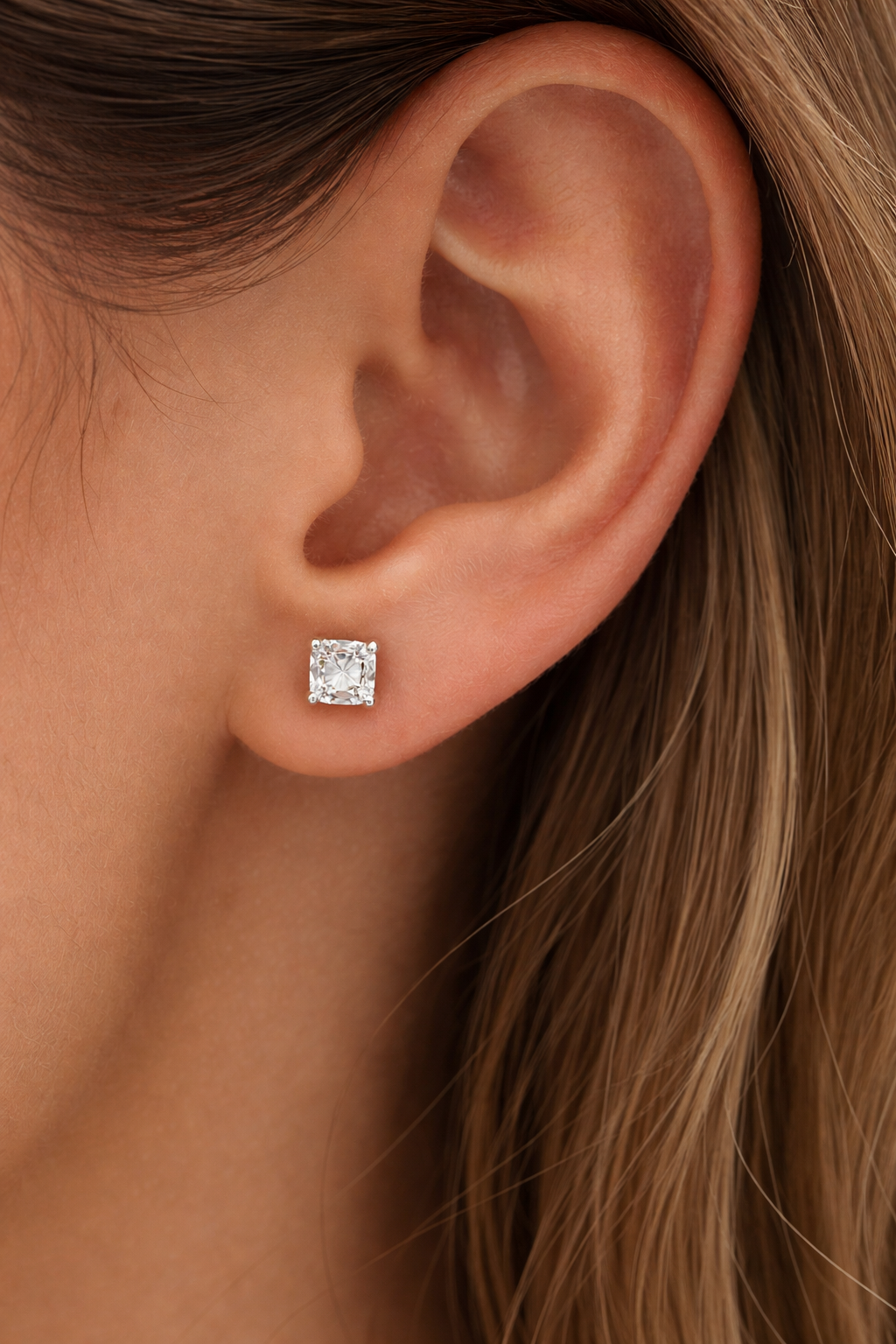Elegant princess-cut diamond earring close-up.png