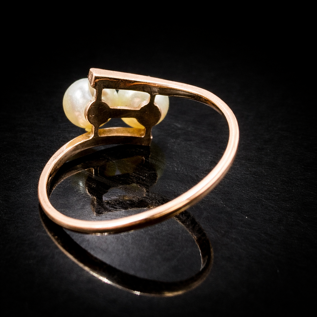 Elegant rose gold and pearl ring.png