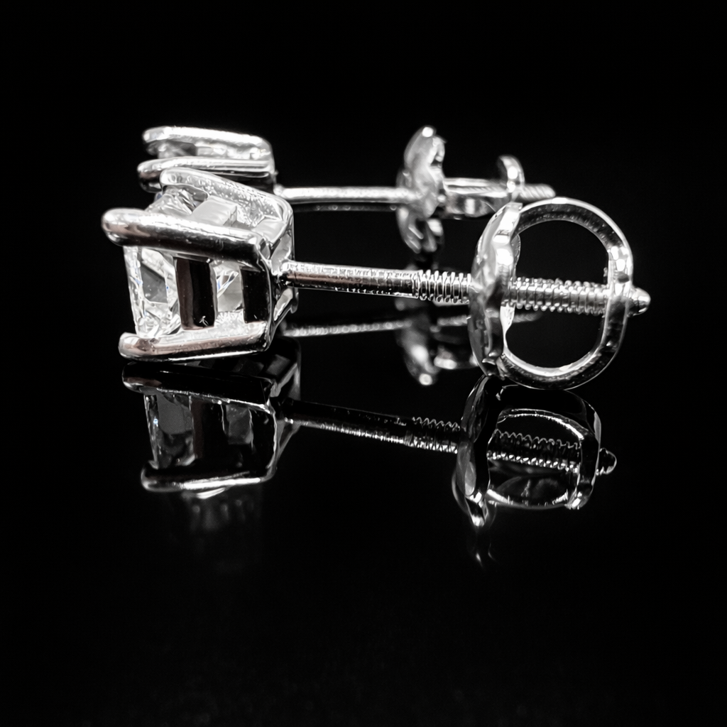 Elegant white gold stud earrings.png