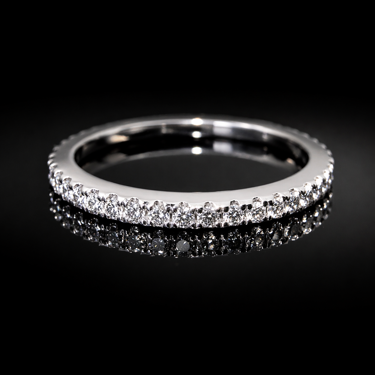 Sparkling diamond eternity ring on black.png
