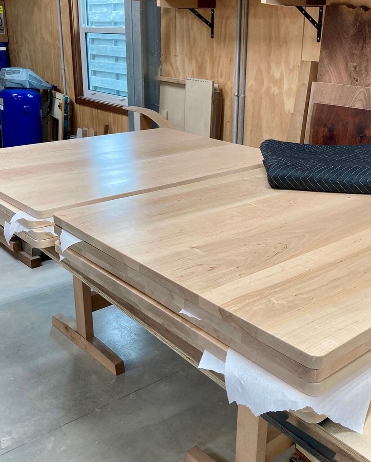 Nine maple table tops out for delivery tomorrow. The objects I make are usually one of one, so this was as mass-production as things get. The challenge was to devote attention to each 250+ square foot of surface and about the same linear feet of edge