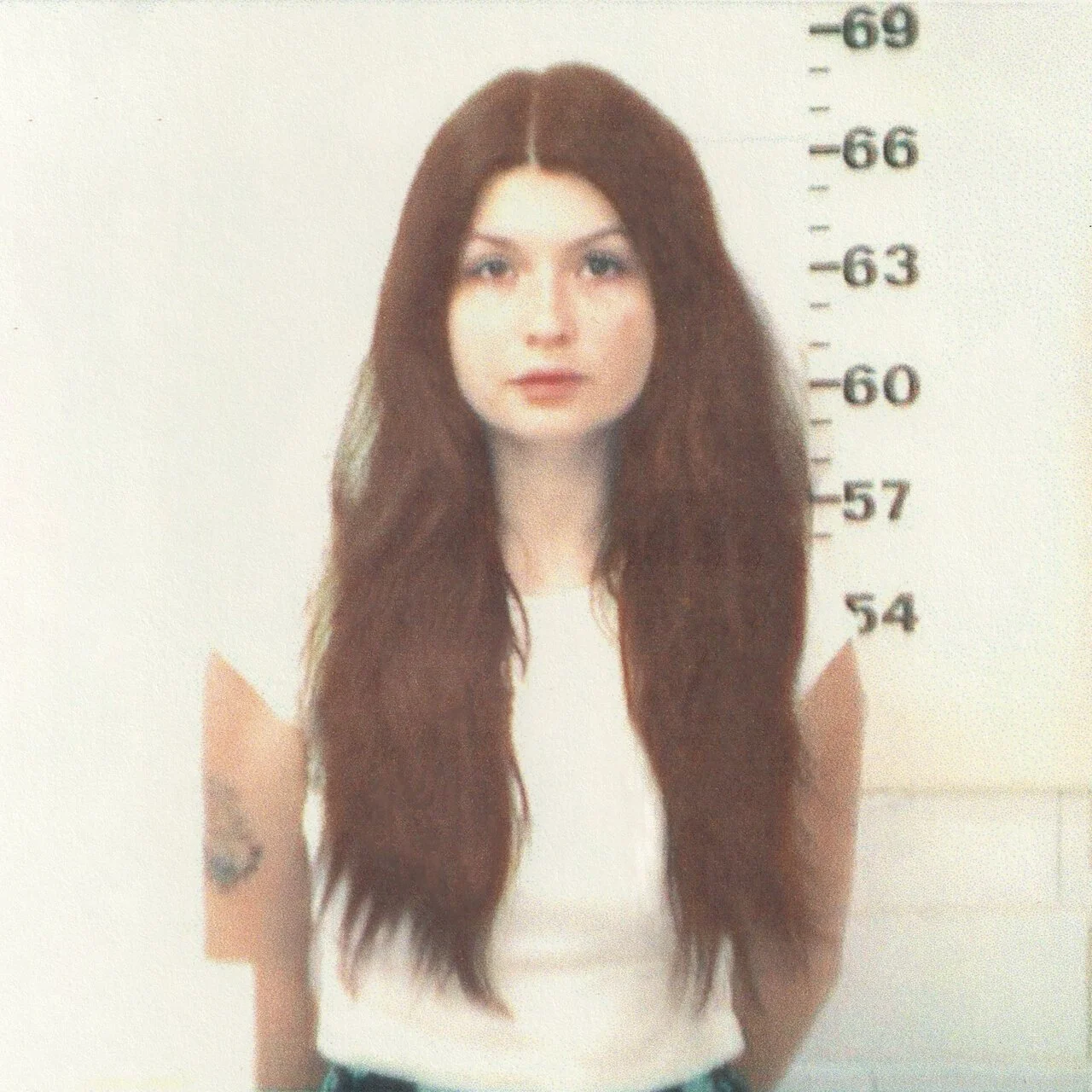 Photo of Willow Avalon looking at the camera in a mugshot kind of way.
