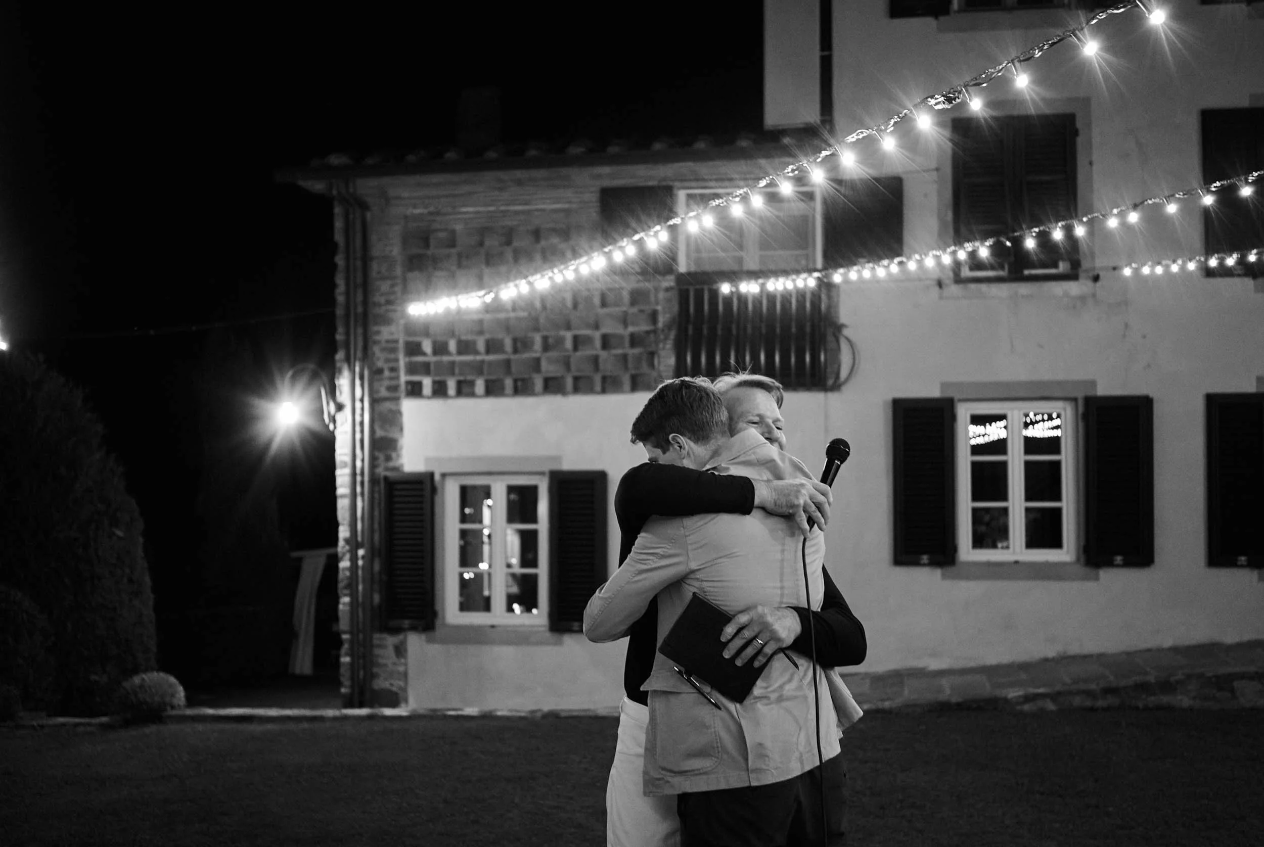 Father and son embracing after a speech