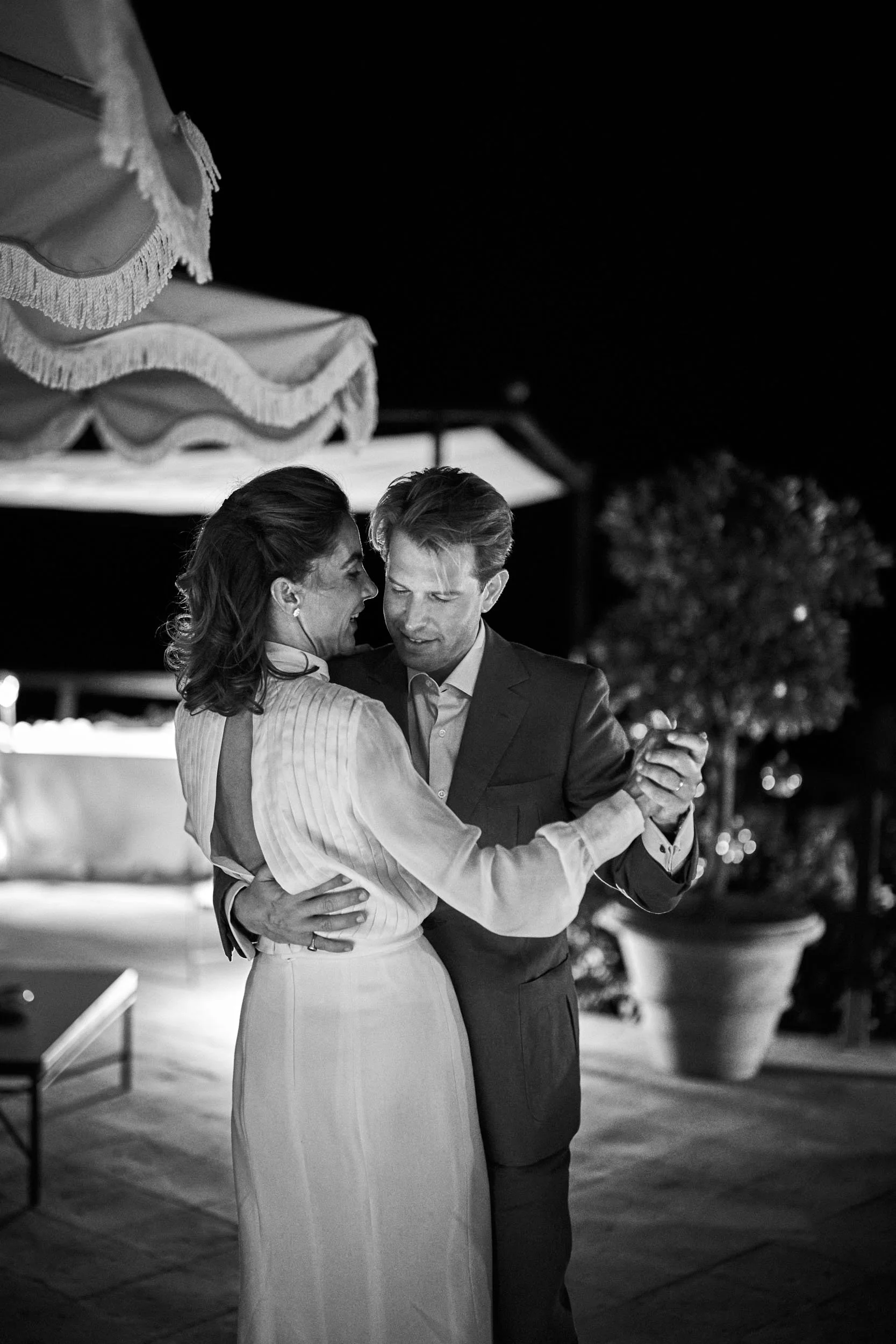 bride and groom slow dance, intimate embrace (black and white).