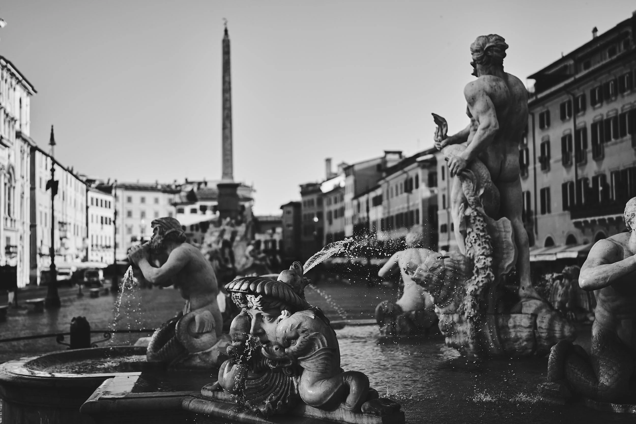 Piazza Navona fountain and obelisk, Rome — black-and-white photograph.y