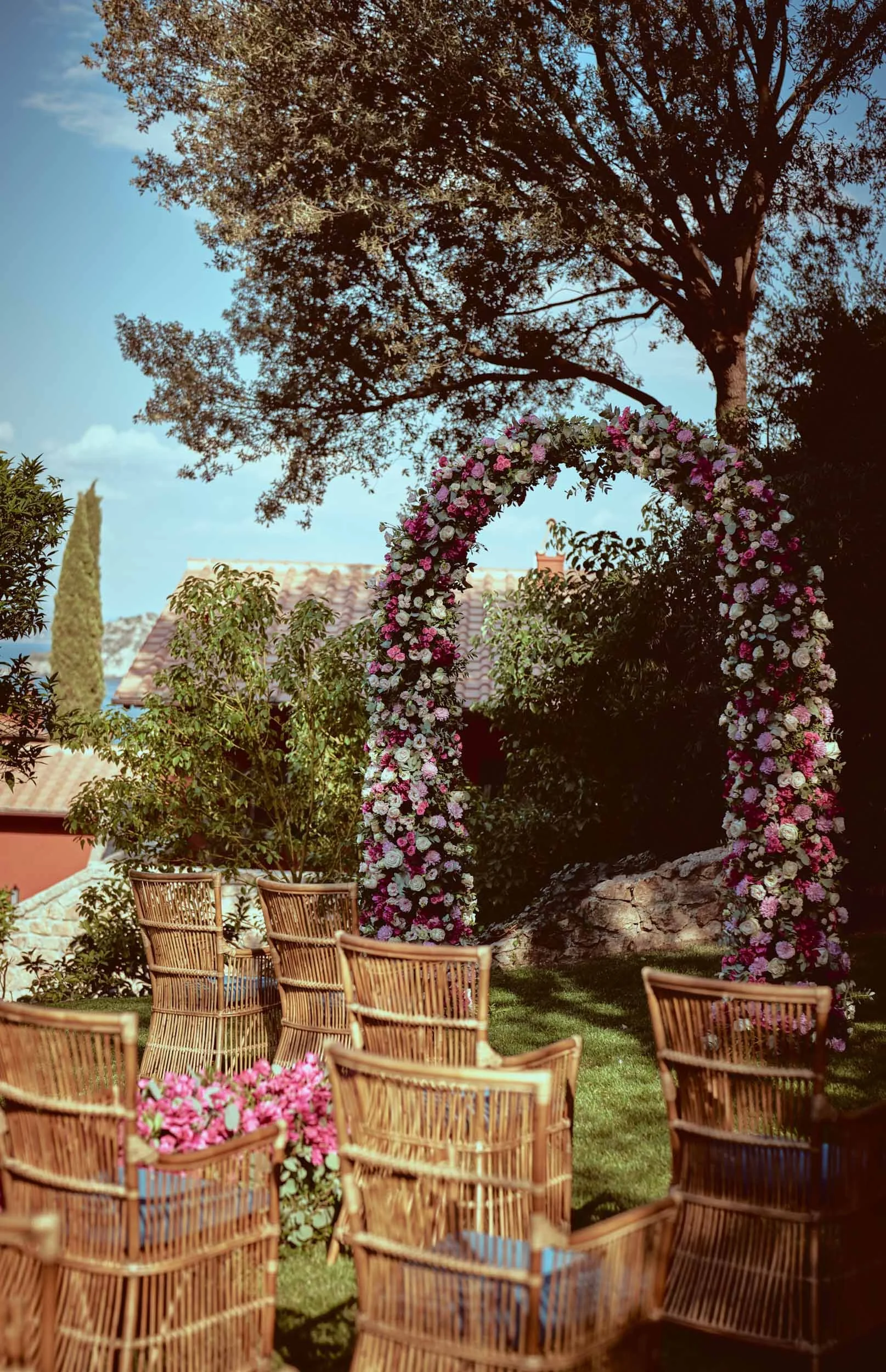 Floral ceremony arch at Hotel Il Pellicano — wedding flowers by Ceccotti Flowers