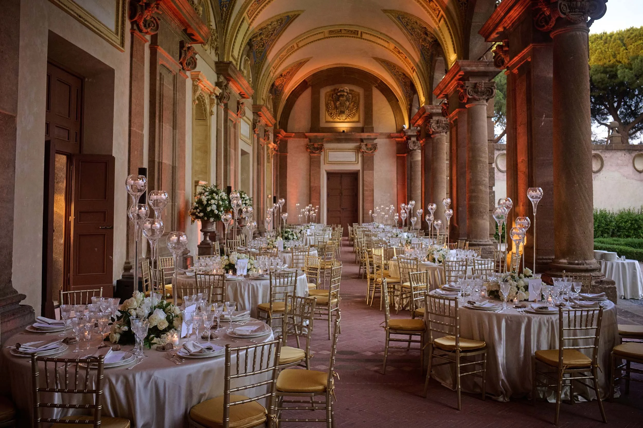 Wedding dinner setup in the courtyard of Villa Mondragone.