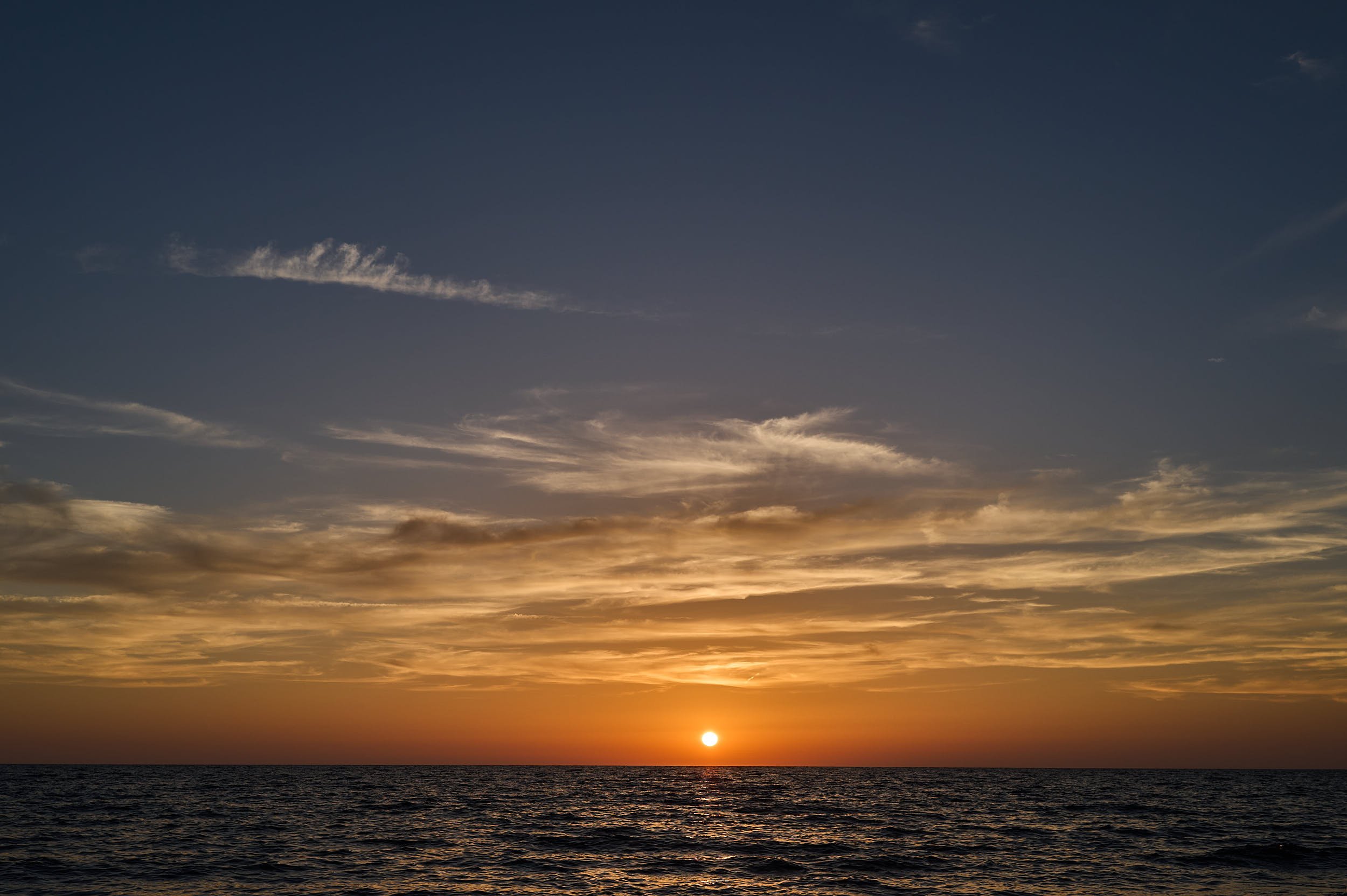 A sunset on a beach. The sun a few minutes before gone behind the horizon.