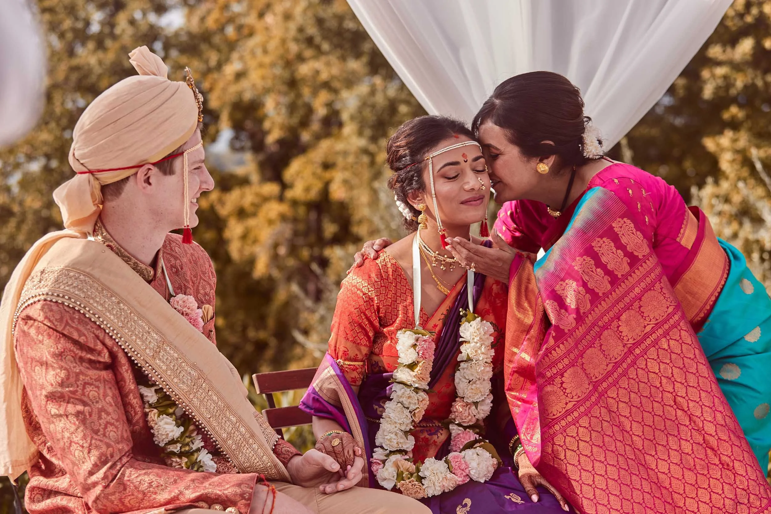 Bride’s mother whispering to her during the ceremony