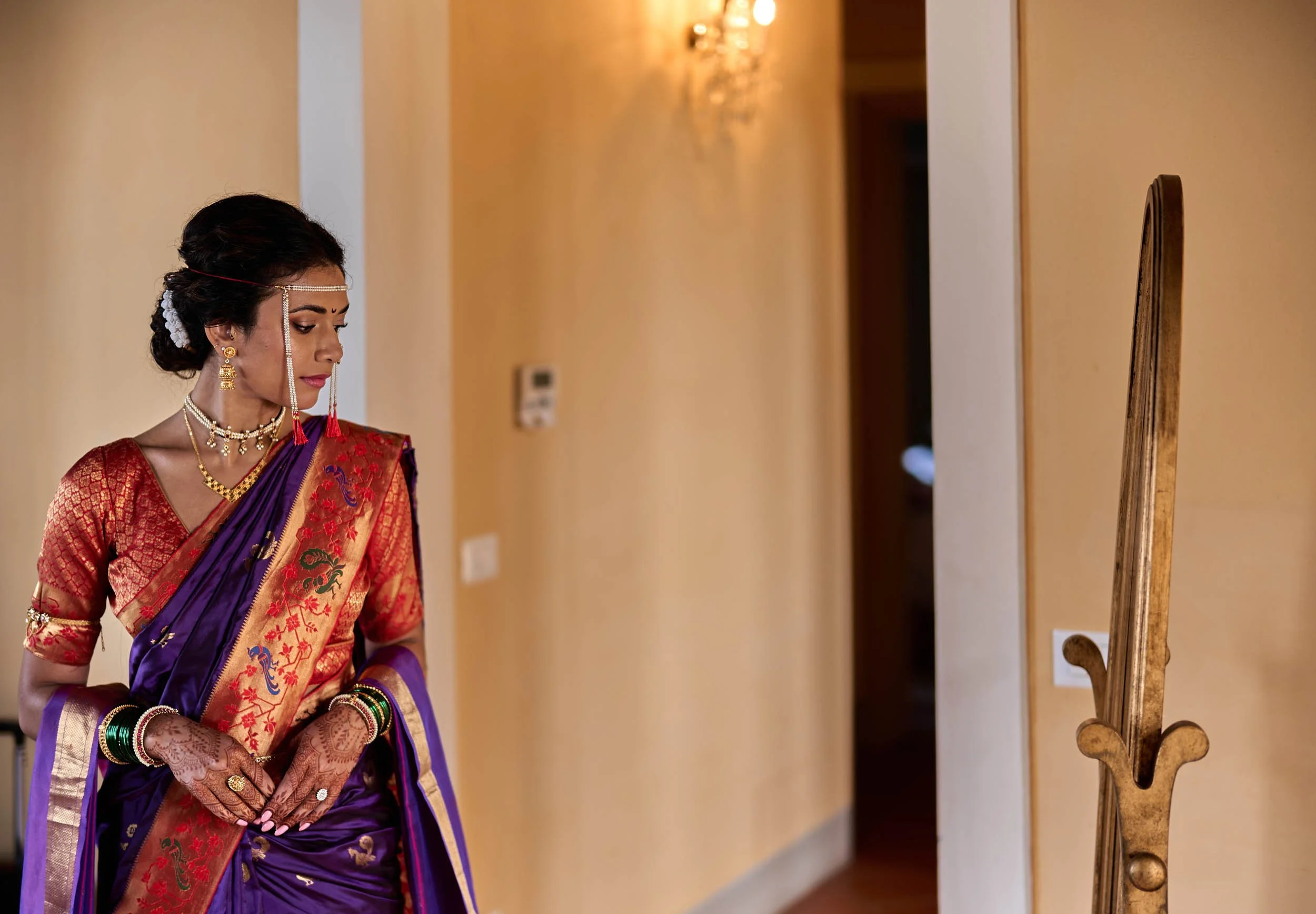 Bride gazing at herself in the mirror after putting on the dress — Tuscany wedding preparations