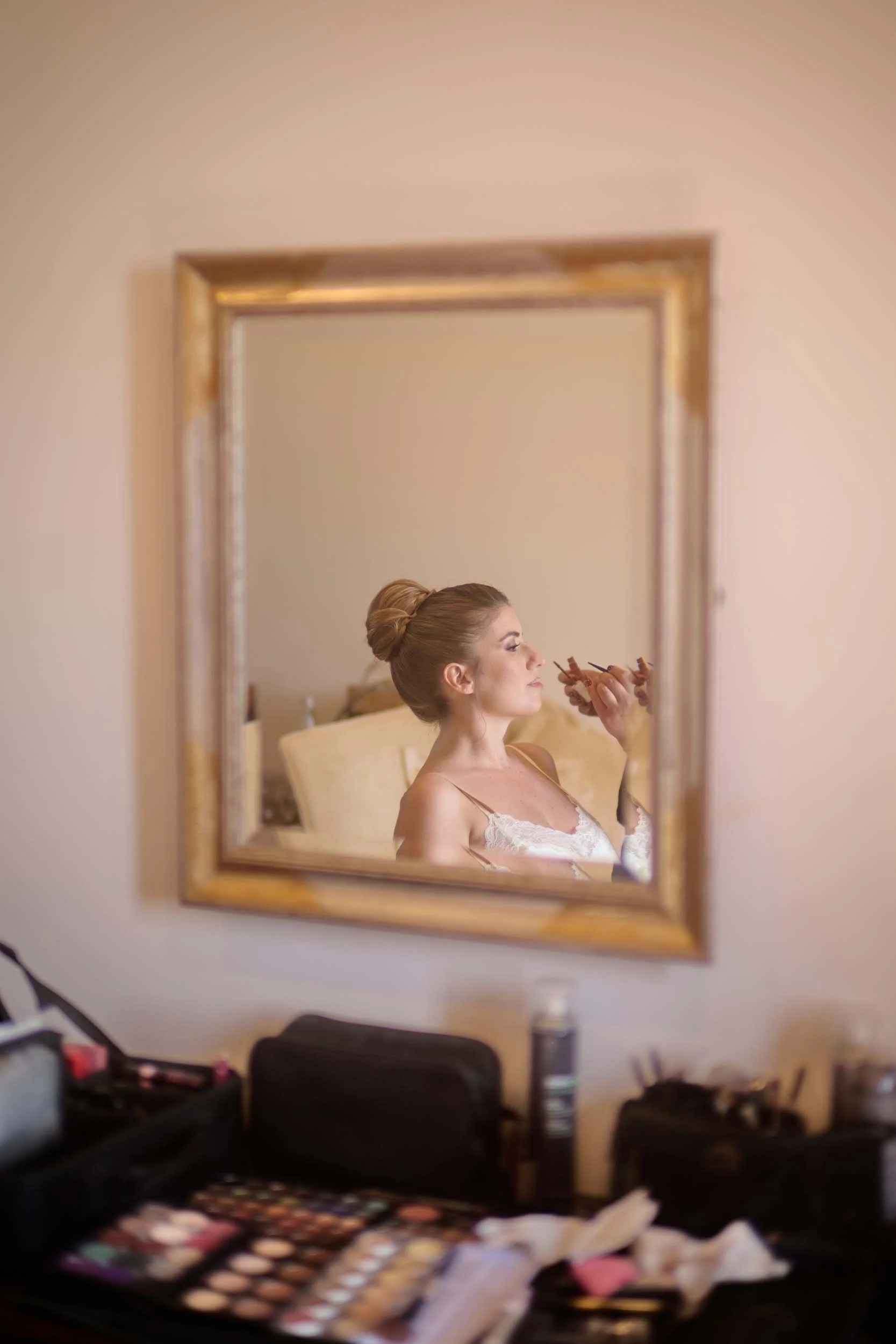 Bride reflected in the mirror during her getting-ready.