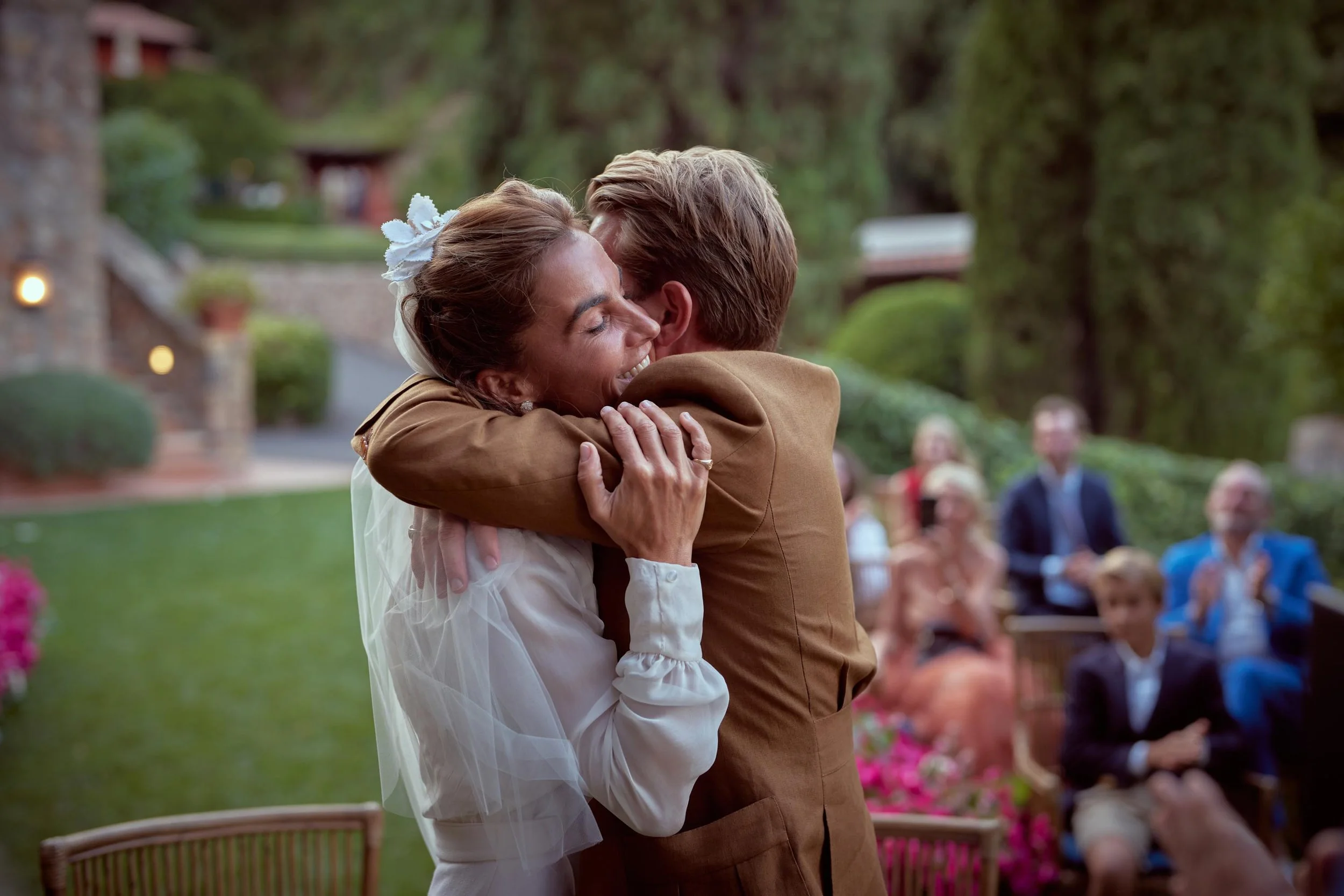 bride and groom embrace after the ceremony.