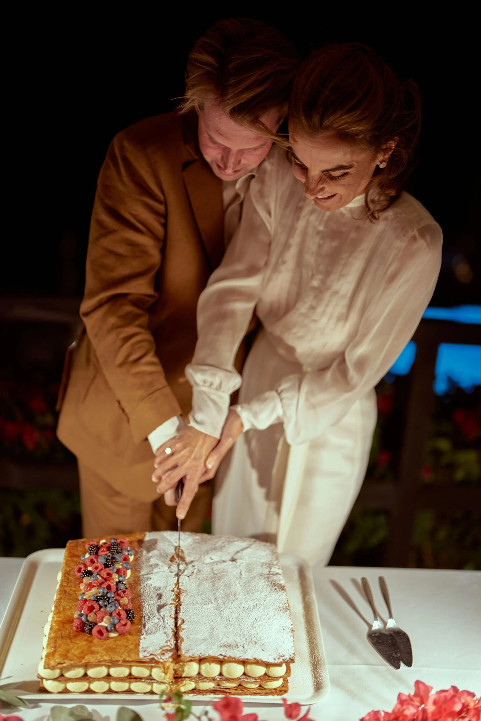 bride and groom cutting the cake at the reception.