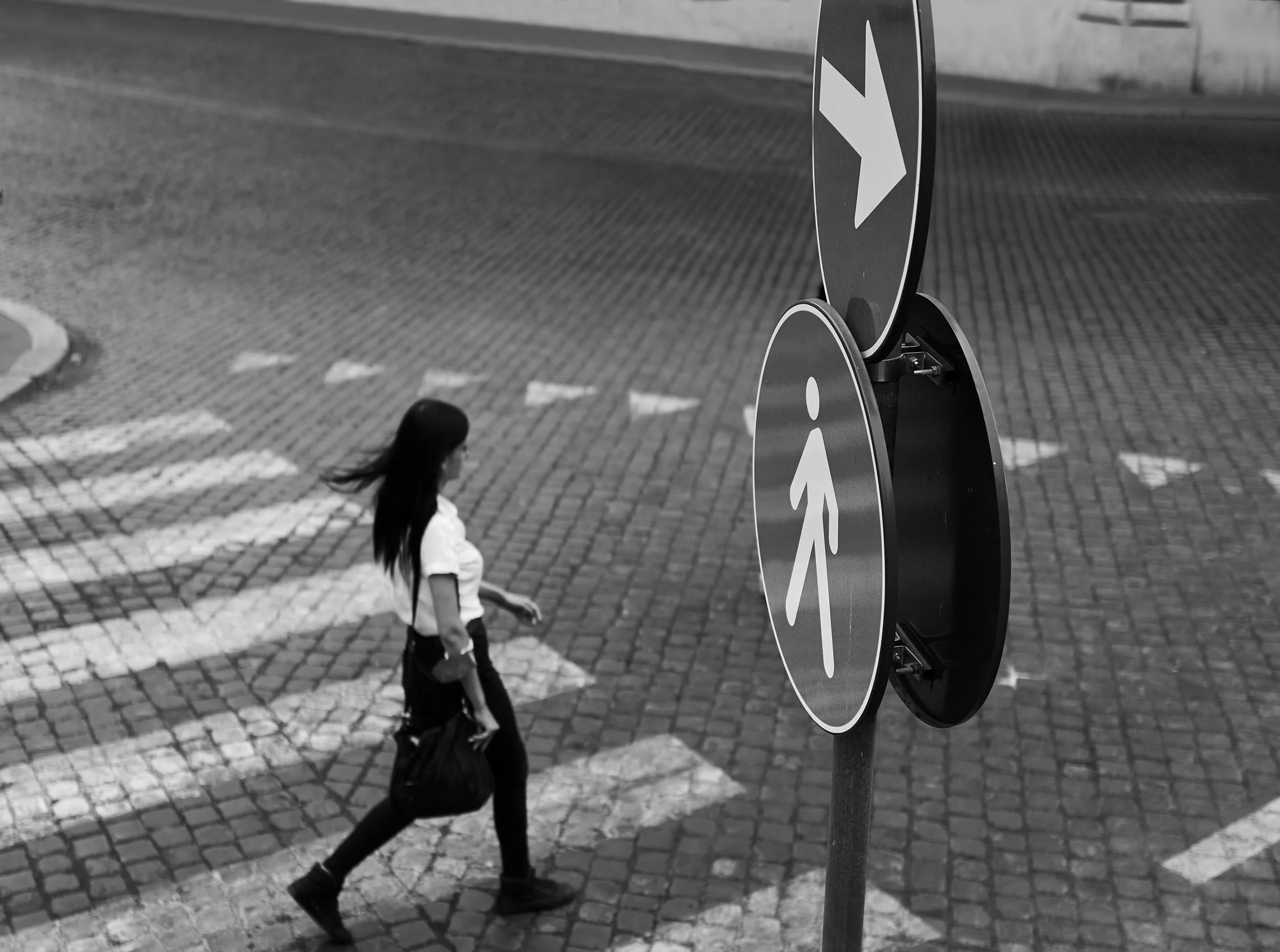 Black and white street photograph in Rome — quiet rhythm and negative space