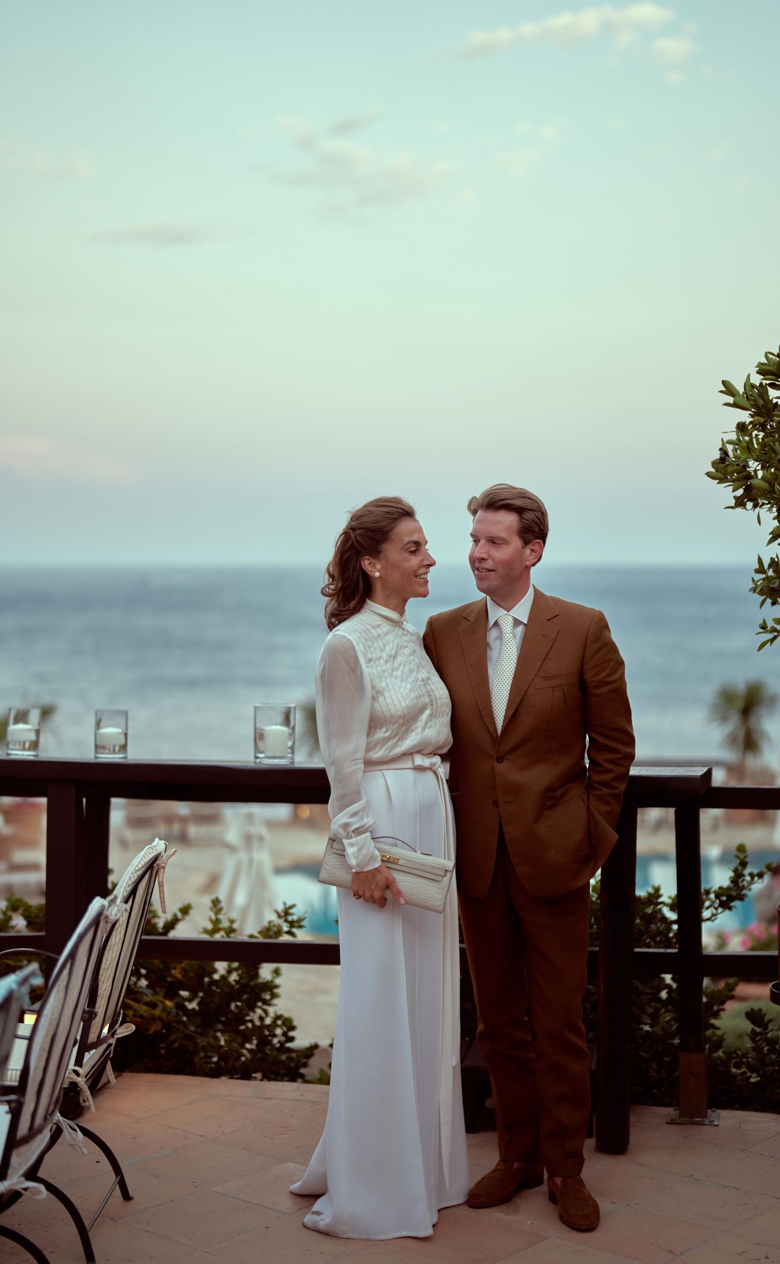 bride and groom portrait on the terrace with sea view, Hotel Il Pellicano.