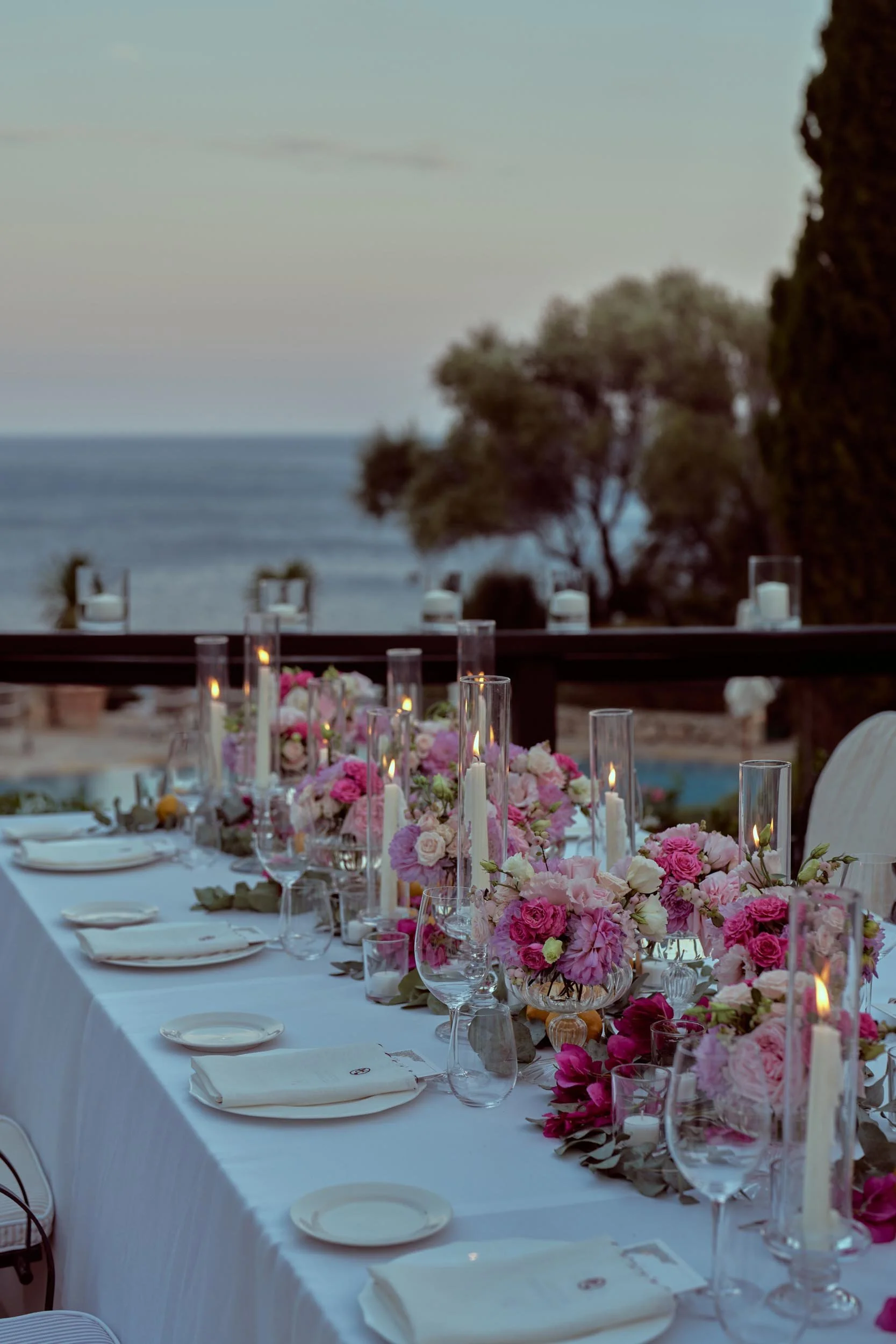 Luxury wedding reception details for a destination wedding in Italy — floral table decorations at Hotel Il Pellicano.