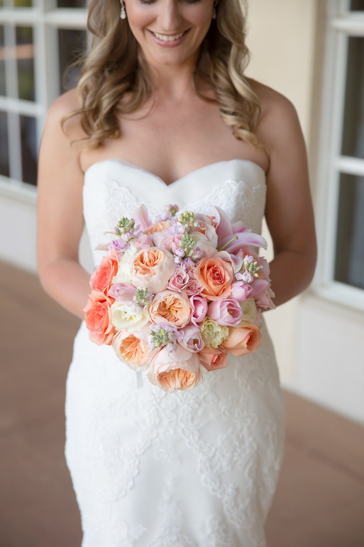 A bride holding a colorful bouquet of flowers