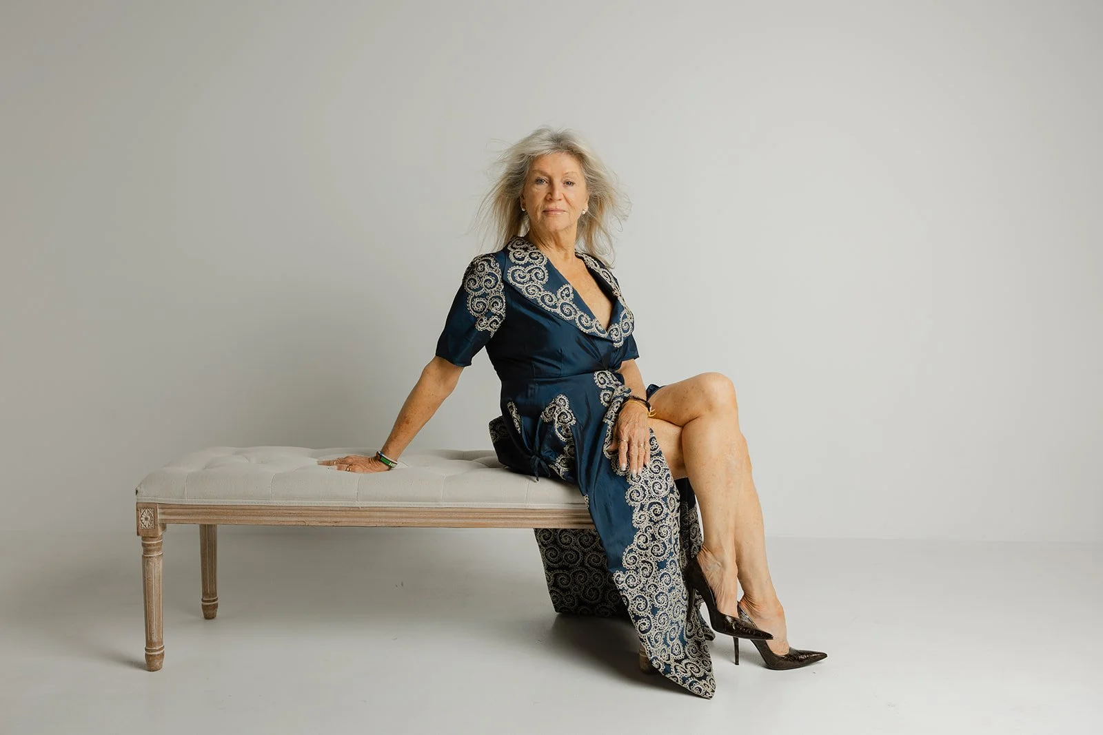 Leigh Kilton-Smith seated on a bench during her 50 Women Project portrait.