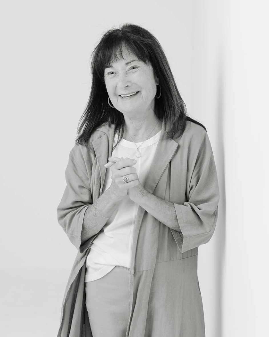 Black and white portrait of Jackie Cole smiling during her 50 Women Project photoshoot with photographer Christine Harris.
