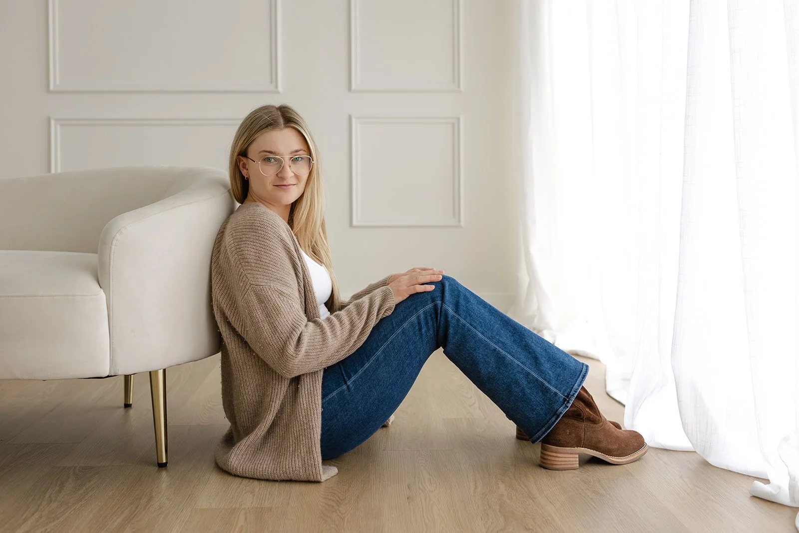 Alex photographed in natural light during a relaxed studio portrait session at The Arlen Studio
