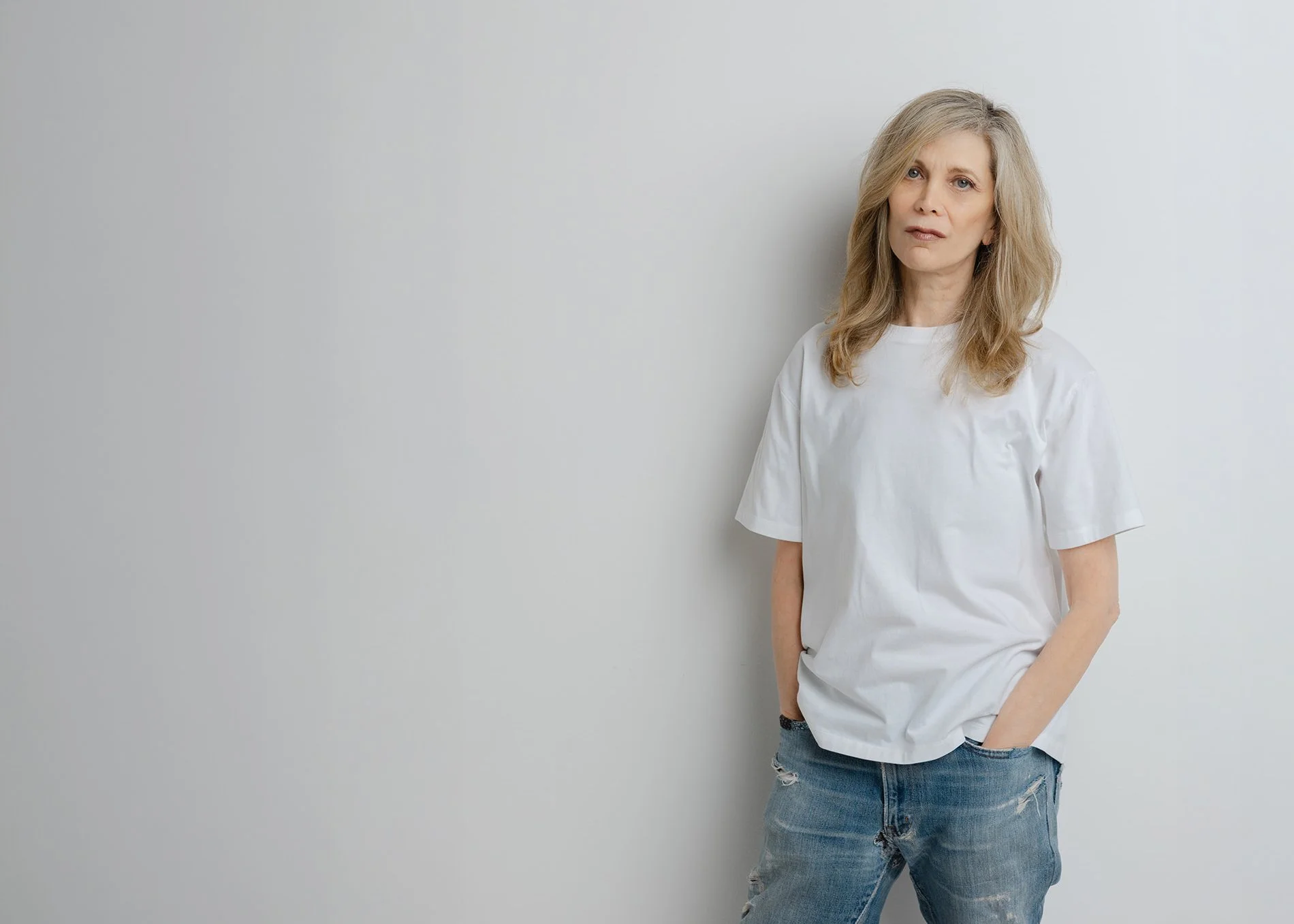 Dayna Pink standing, white t-shirt, studio portrait by Christine Harris for the 50 Women Project
