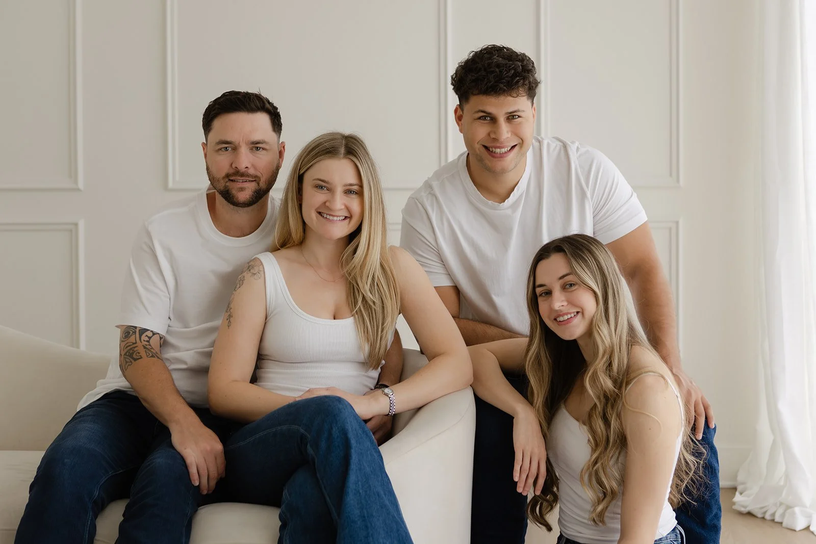 Alex, Gabby, Anton, and Angel photographed together during a natural light studio portrait session at The Arlen Studio