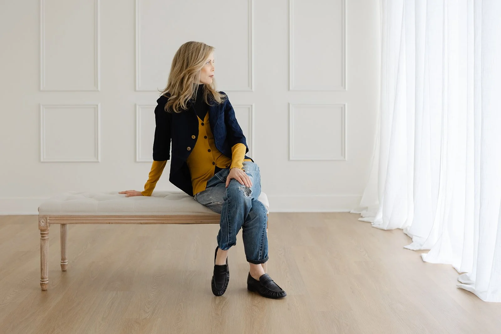 Dayna Pink seated, studio portrait by Christine Harris for the 50 Women Project